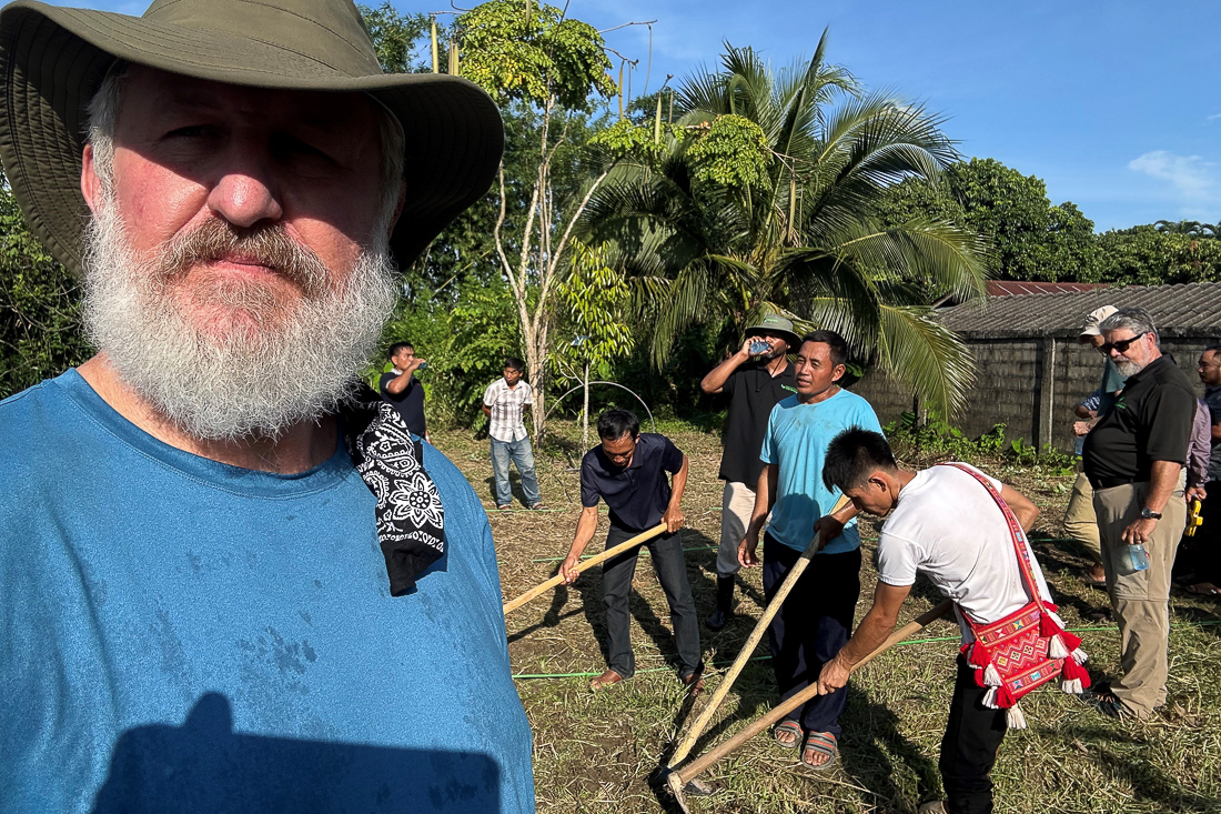 Frank Sindler, left, helping train South Asian pastors gathered in Thailand.